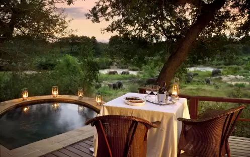 Lion Sands, Tinga Lodge-Tinga Lodge suite, dinner on private deck Lion Sands, Tinga Lodge-Tinga Lodge suite, dinner on private deck