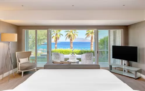 CARESSE HOTEL - DELUXE MARINE SUITE BEDROOM CARESSE HOTEL - DELUXE MARINE SUITE BEDROOM