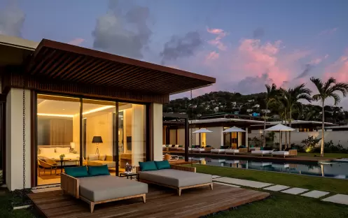 12_-beachfront-villa-main-master-bedroom-terrace-at-dusk-65552c63acf43 12_-beachfront-villa-main-master-bedroom-terrace-at-dusk-65552c63acf43