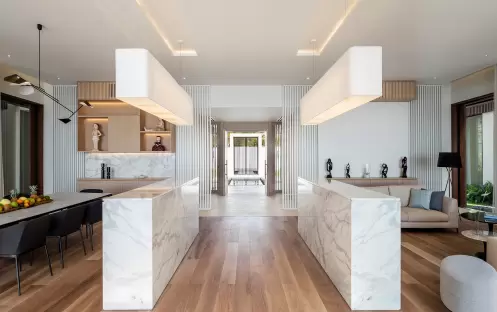 3_-beachfront-villa-dining-and-living-areas-looking-to-entrance-65552c590cd28 3_-beachfront-villa-dining-and-living-areas-looking-to-entrance-65552c590cd28
